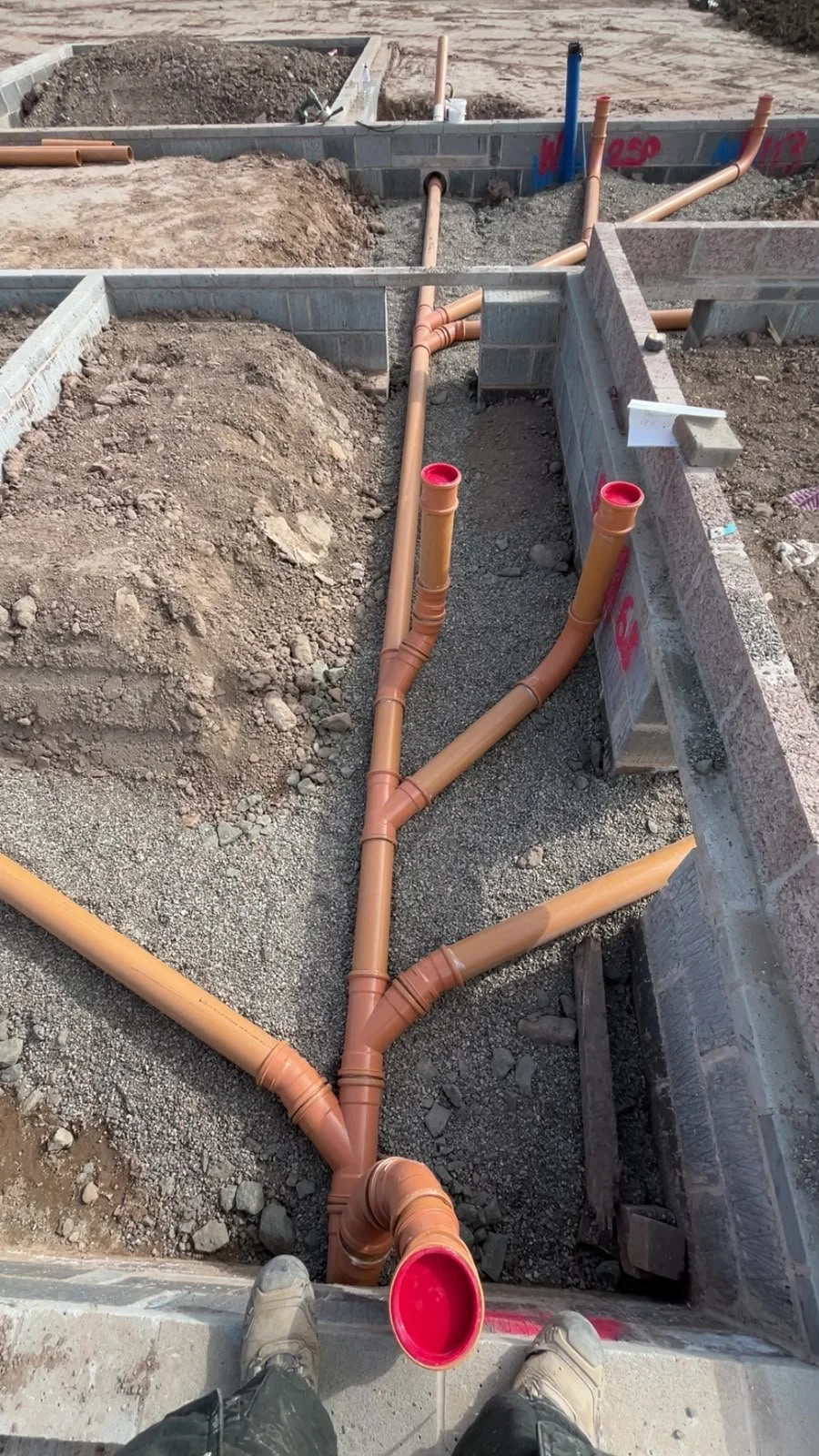 Drainage trench and pipework on a Bishopton building plot.