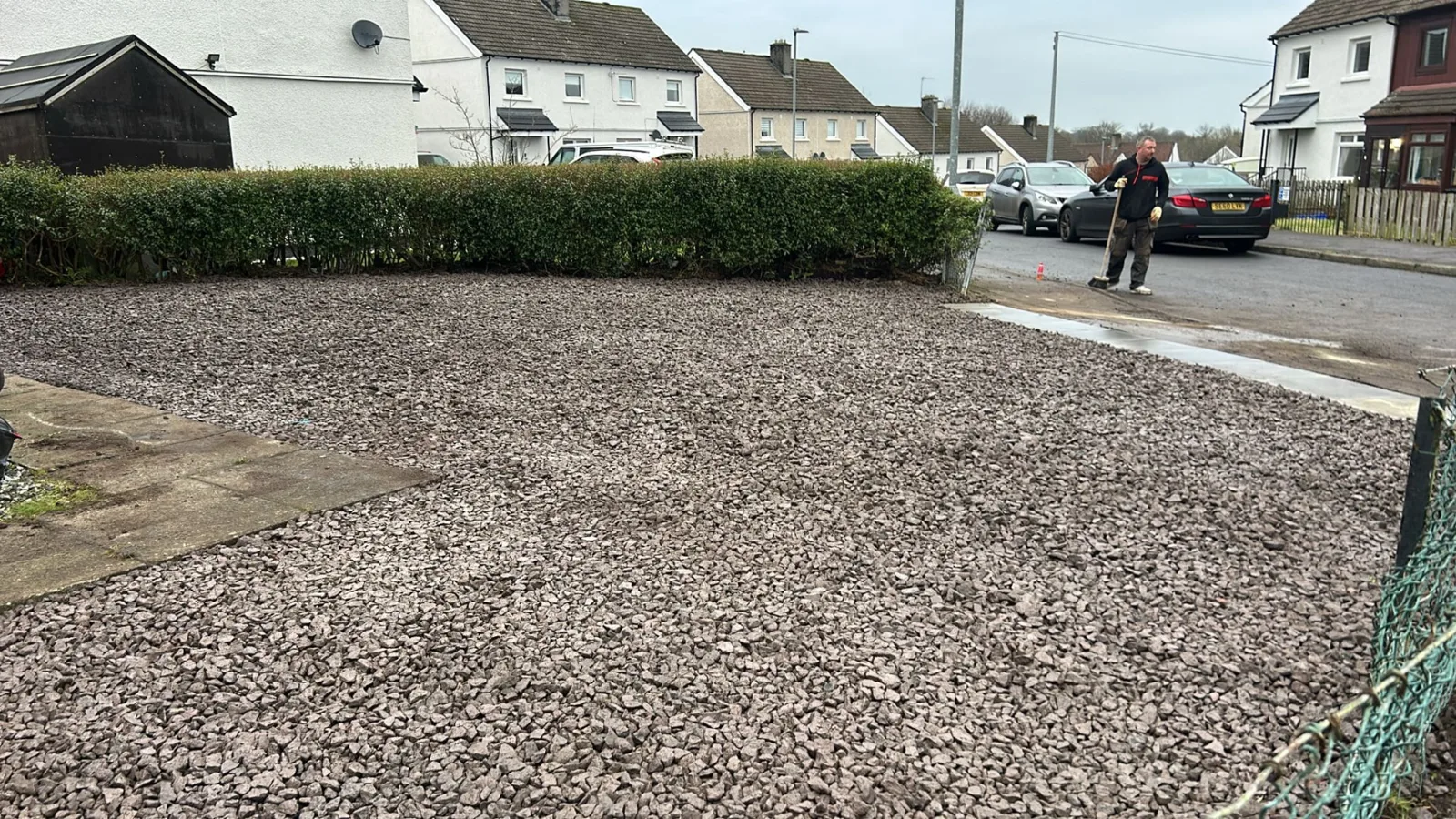 Front garden in Dalry raked level and finished with fresh gravel, with the pathway and road edge left clean.