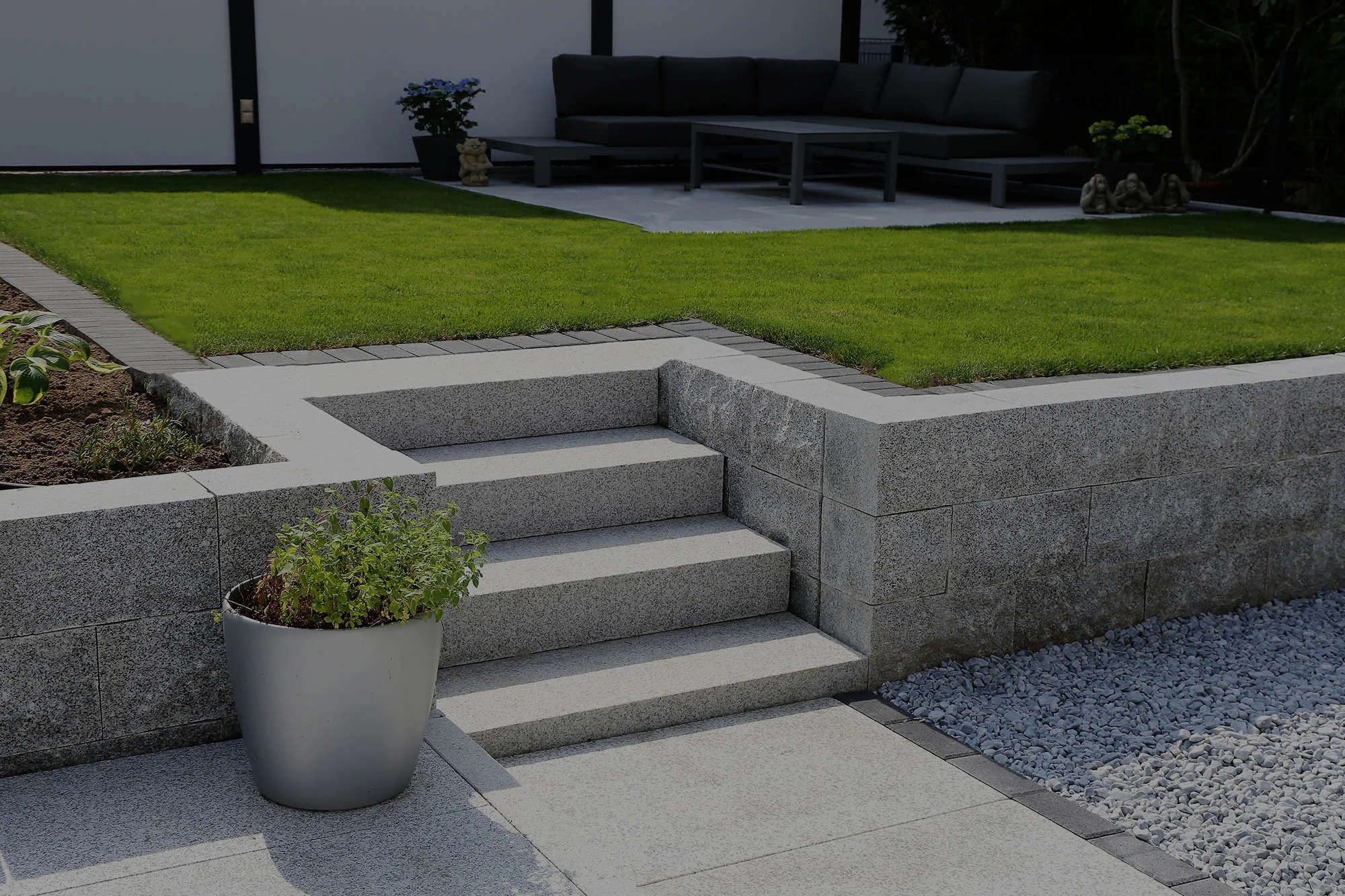 Monoblock driveway with charcoal and grey paving.