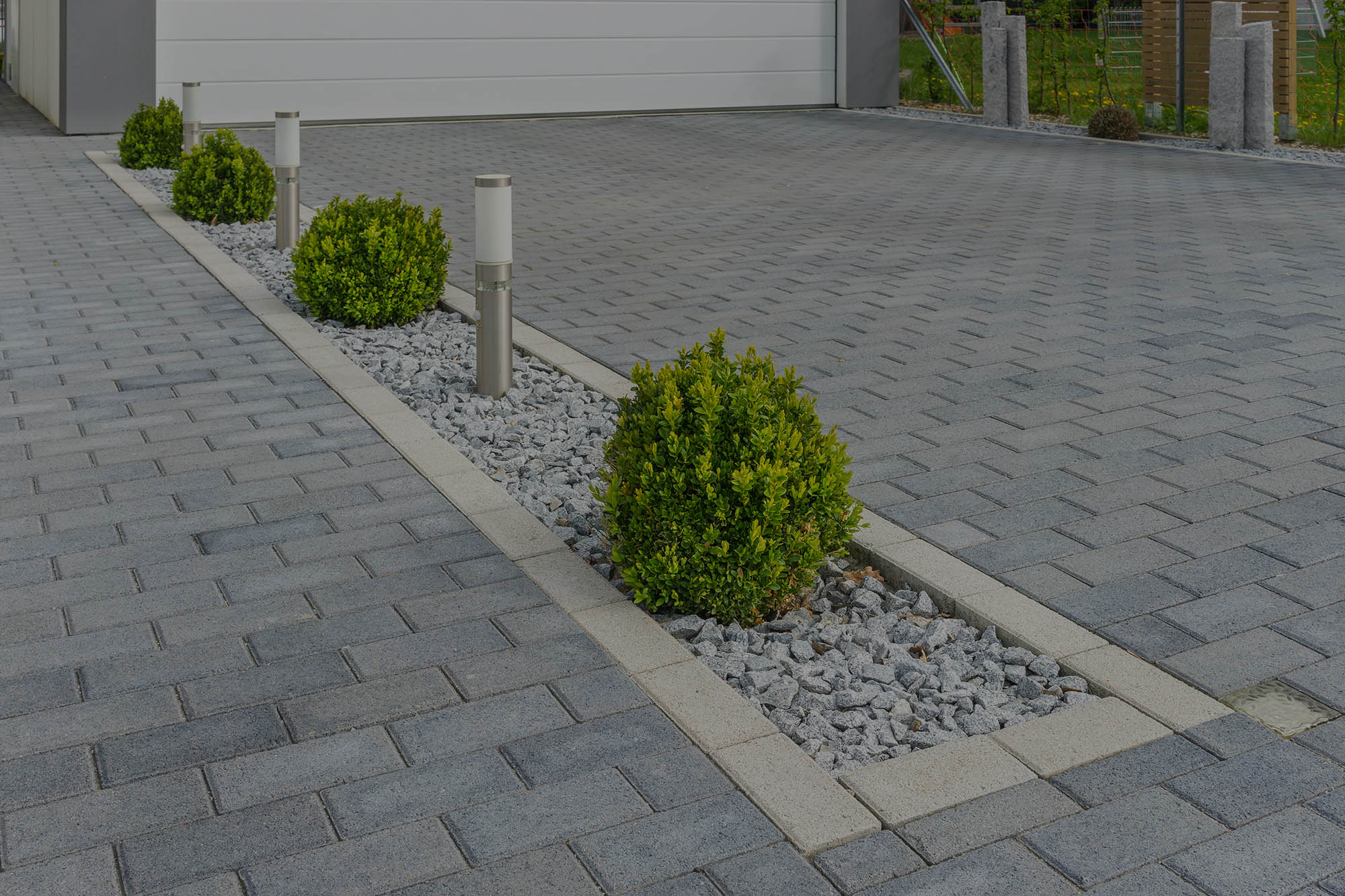 Herringbone block paving with borders