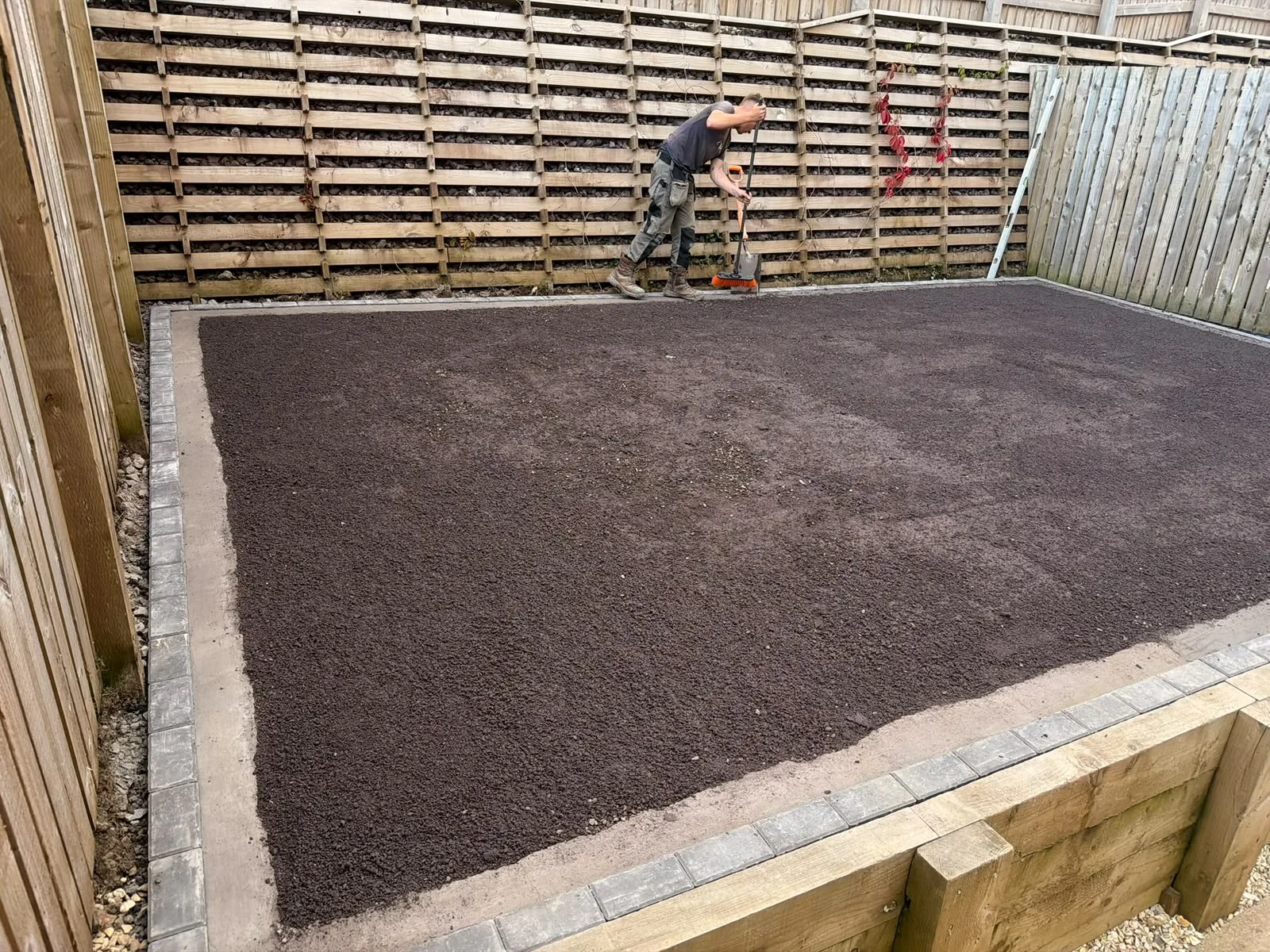 Ground being levelled by Jackson's inside sleeper retaining walls with block edging, ready for the next stage.