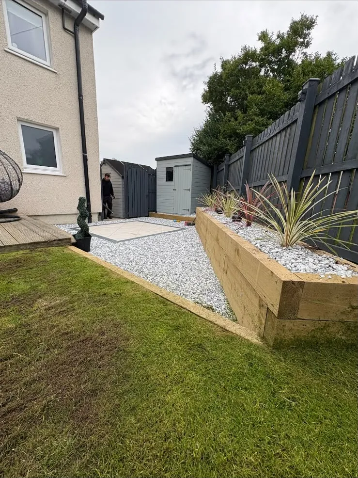 Raised sleeper flower bed with chips and porcelain tiles, Ayr.