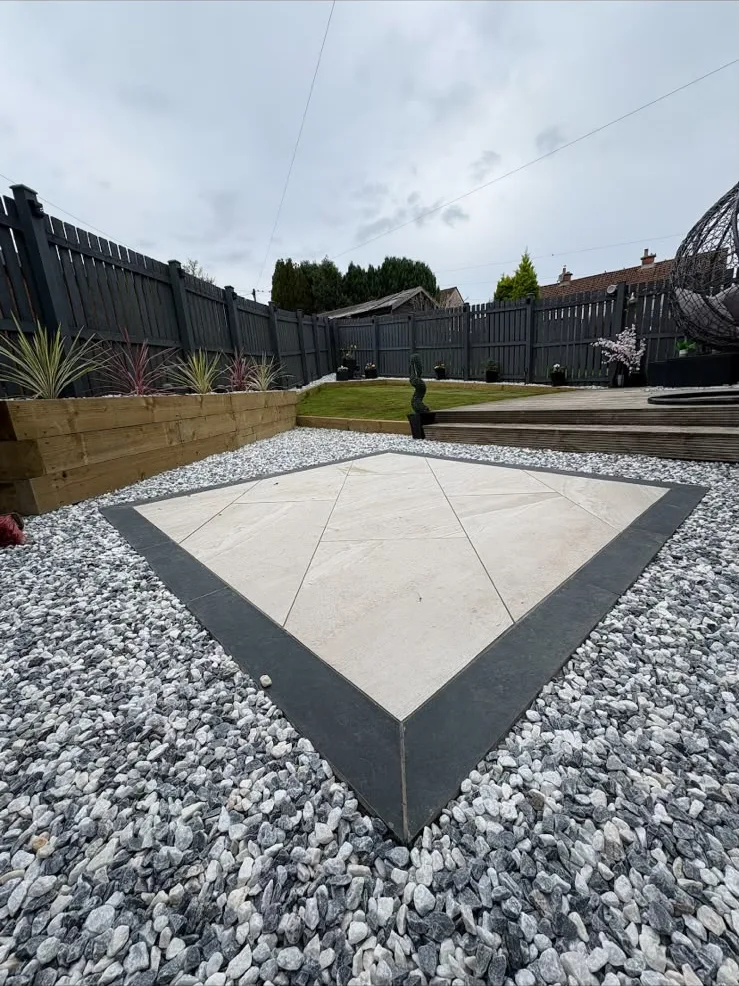 Porcelain tiles with a dark border set in decorative chips, Ayr.